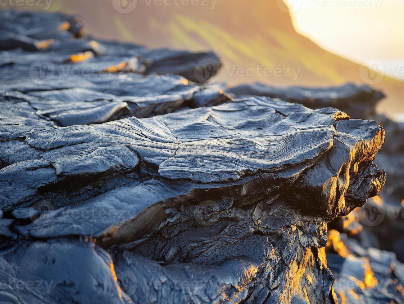 Lava rock formations hint at volcanic activity during sunset near coastline photo
