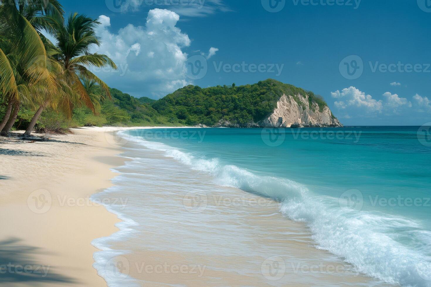 Tropical beach with white sand, turquoise water and palm trees meeting a green hill and a beautiful blue sky photo