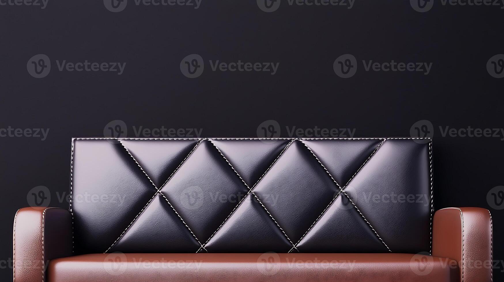 Elegant black and brown leather sofa against a dark wall, ideal for modern interior design photo