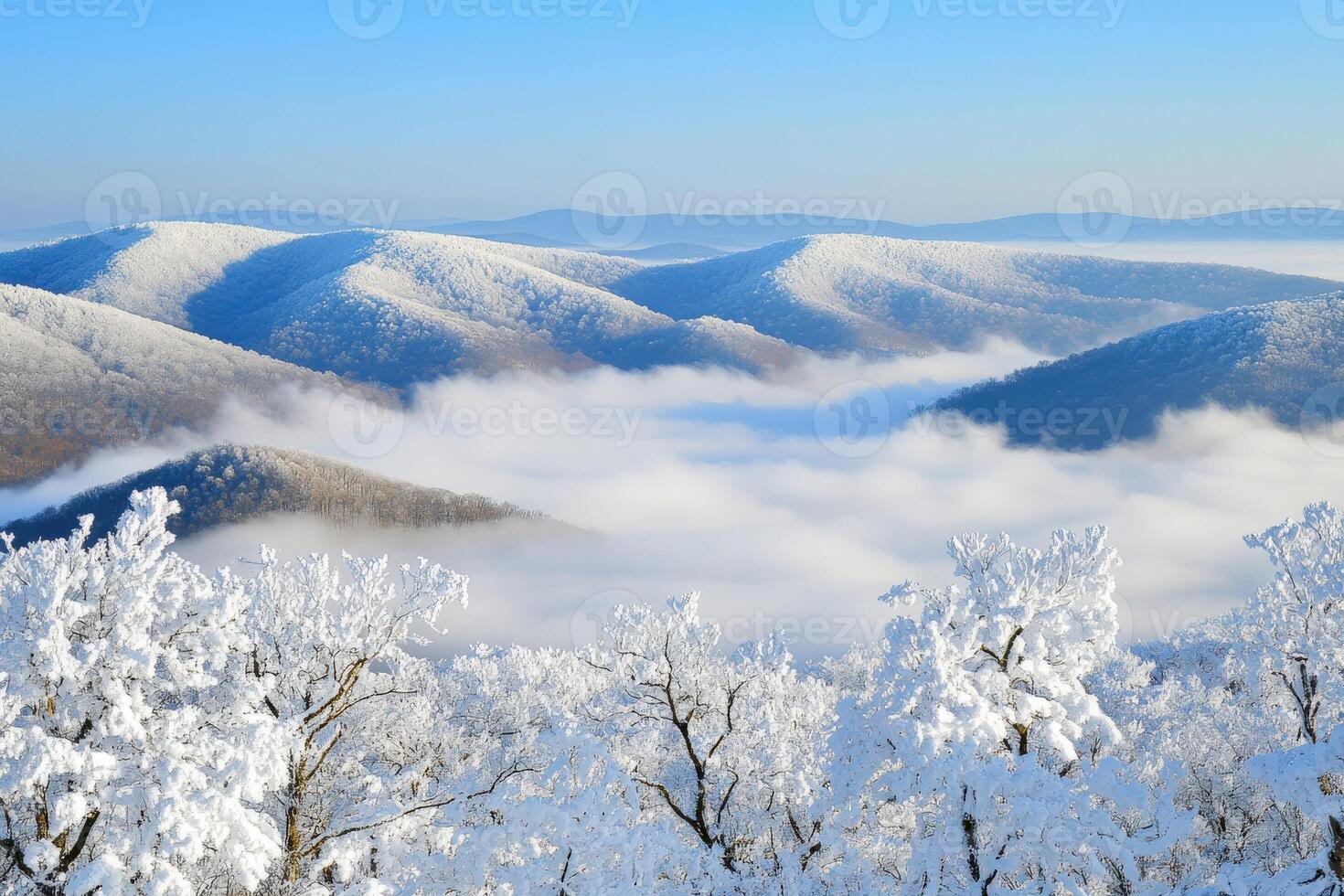 Snow-covered mountain landscape with fog photo