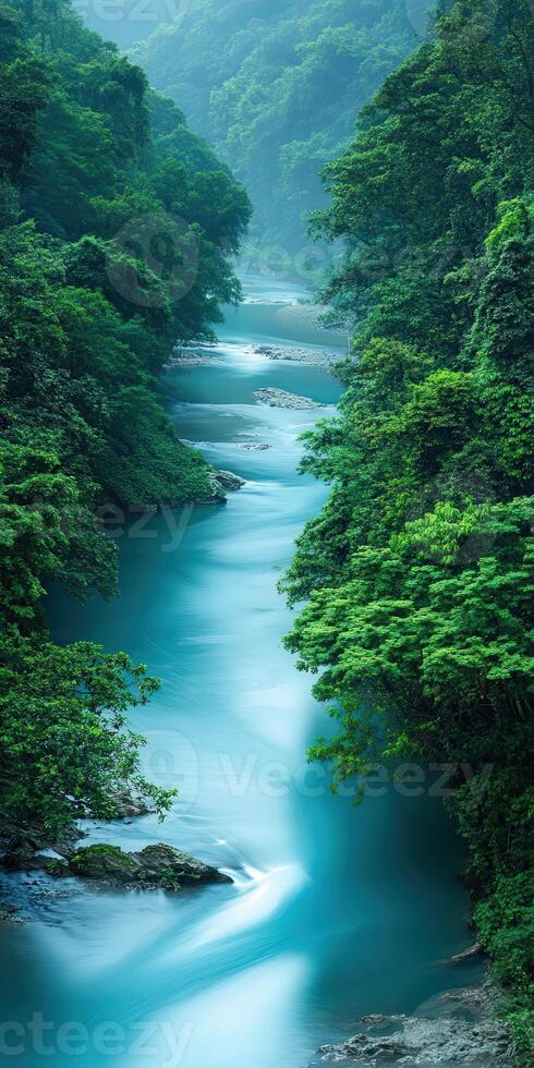 Majestic river flowing through lush forest photo