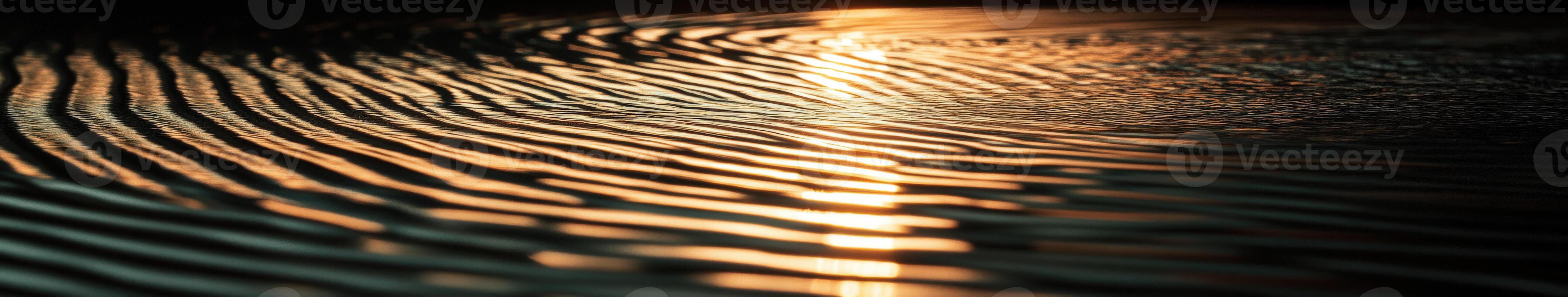 Sunlight reflecting off of waves in a dark water photo