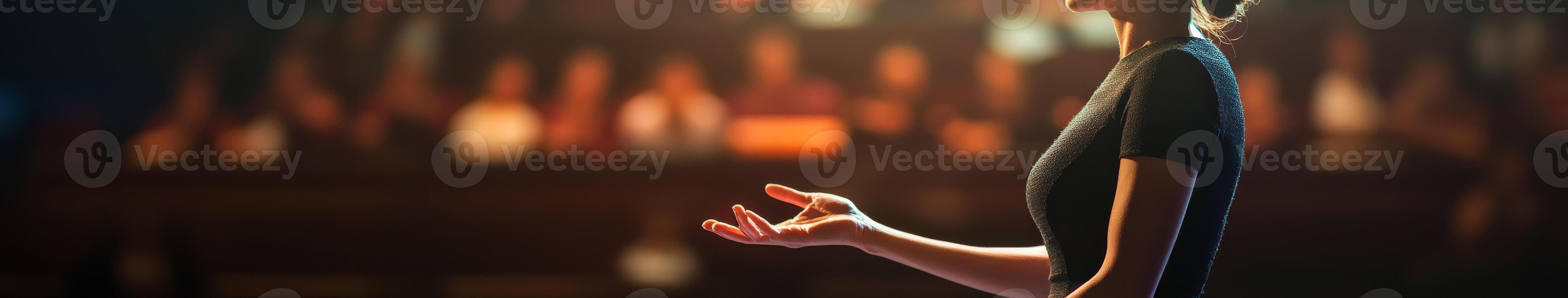 A person standing with their hands outstretched photo