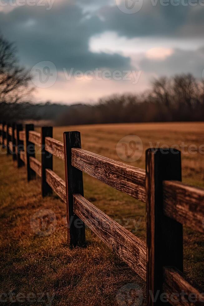 A fence in the middle of a field photo