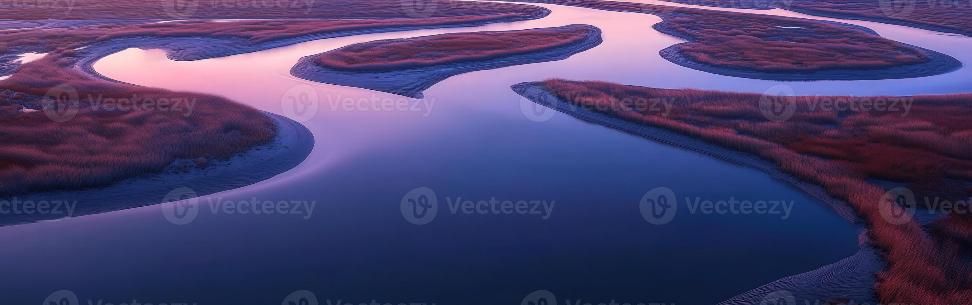 An aerial view of a river and marsh at sunset photo