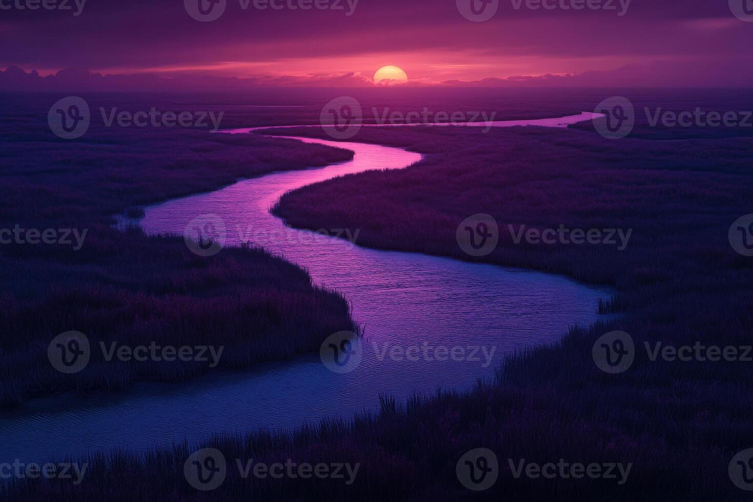 A river runs through a marsh at sunset photo