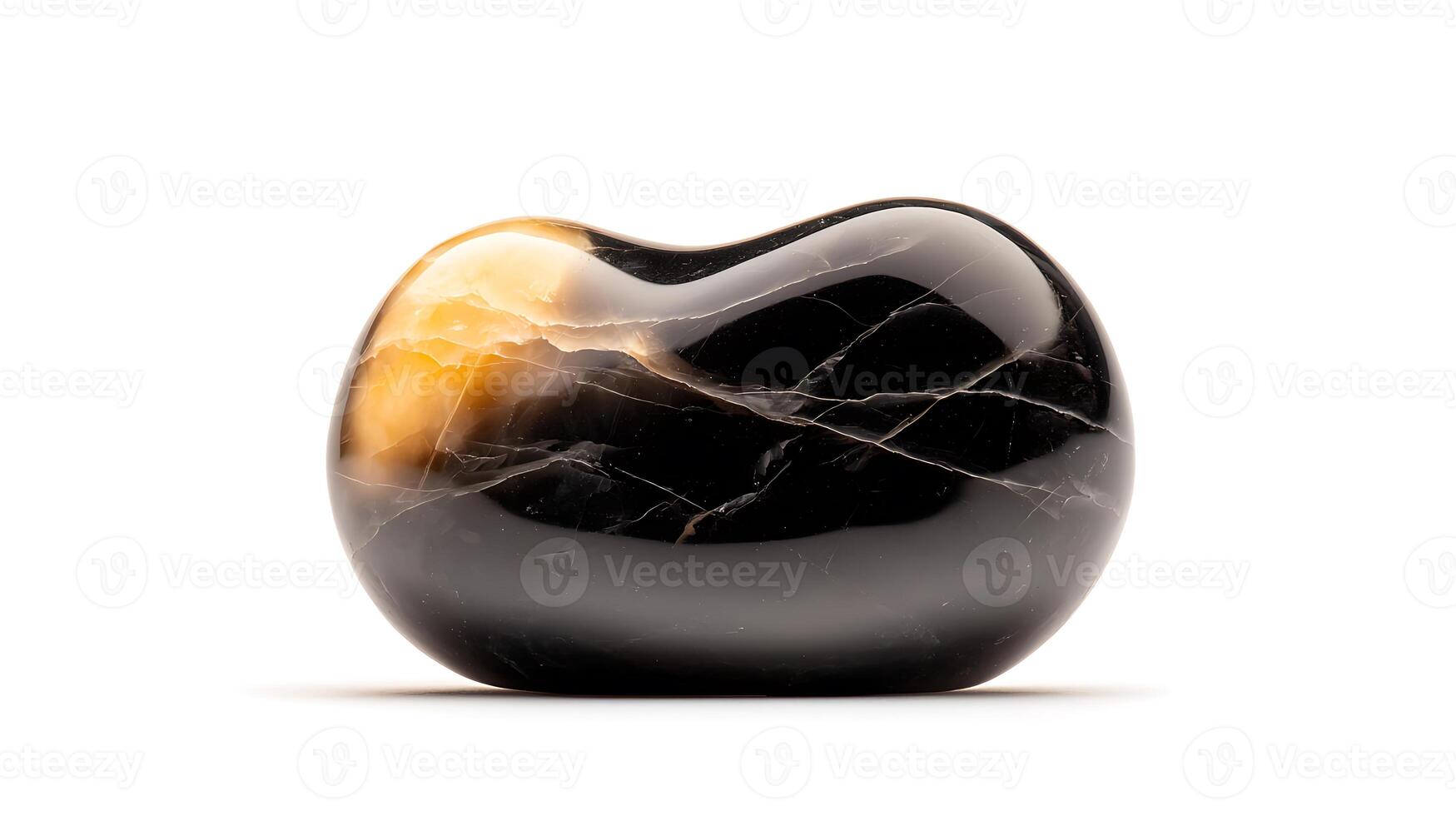 Smooth black and gold polished stone on a white background, highlighting natural beauty and texture photo