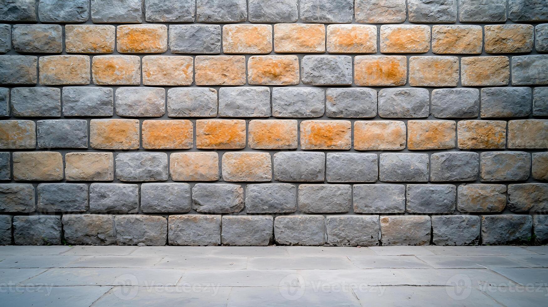 Textured stone wall with gray and orange bricks, showcasing architectural design elements photo