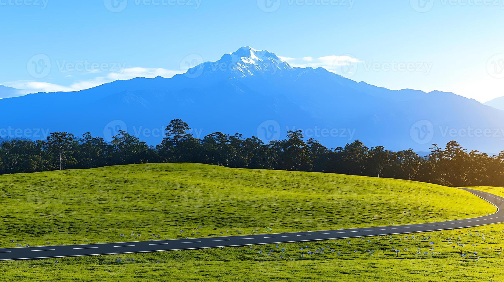 Serene landscape featuring a majestic mountain backdrop with a winding road and lush greenery photo