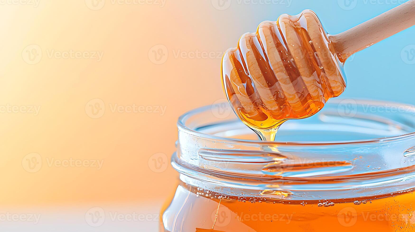 Close-up of honey dripping from a wooden dipper into a jar against a soft gradient background photo
