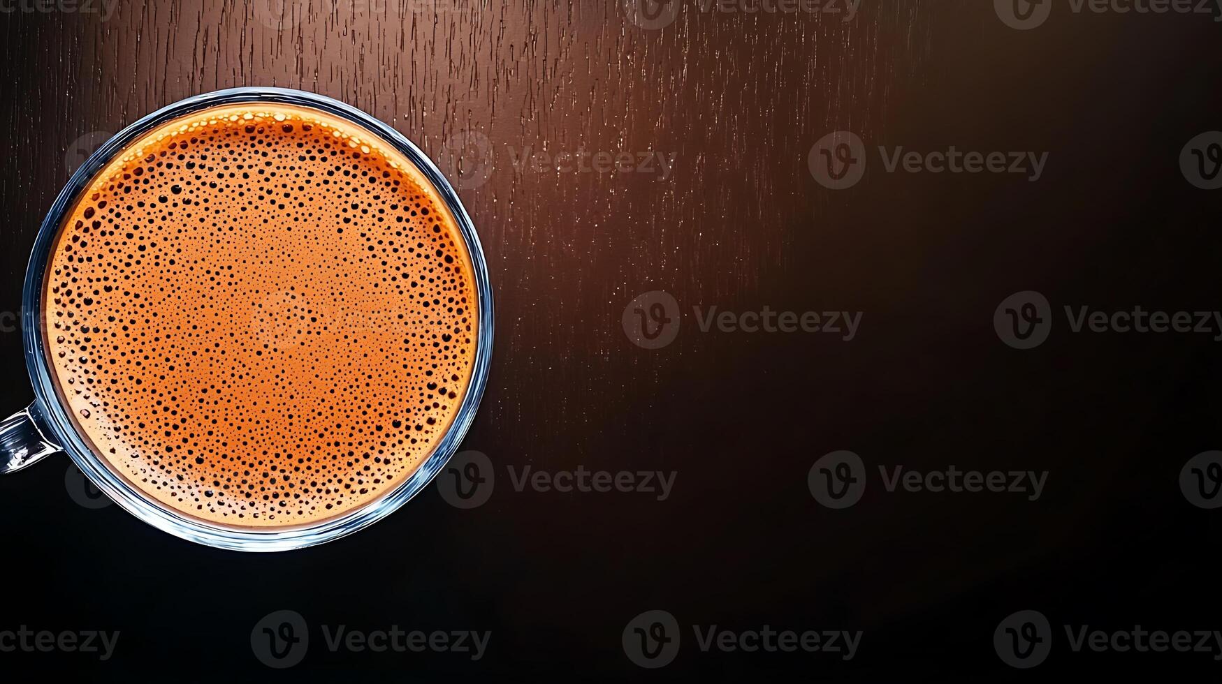 Close-up of a steaming cup of coffee on a dark wooden surface with soft lighting photo