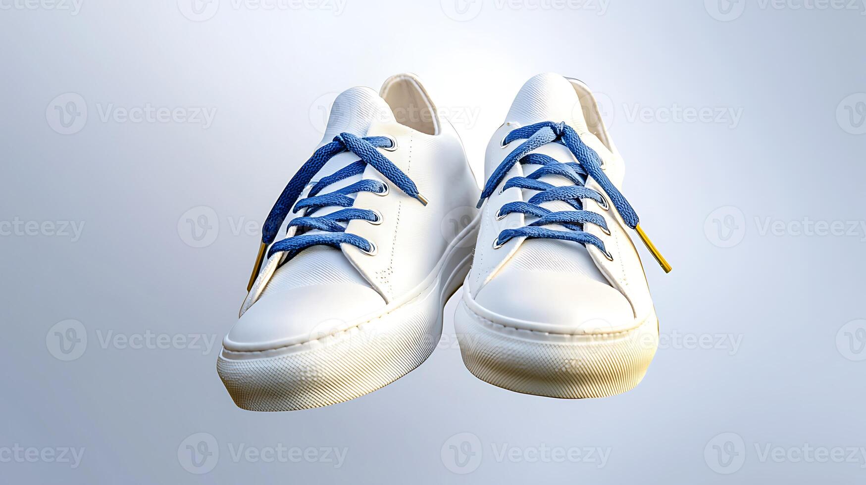 Stylish white sneakers with blue laces floating against a soft gradient background photo