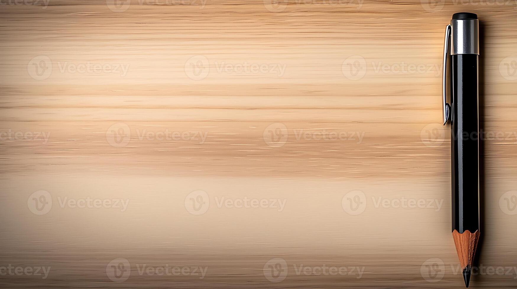 Close-up of a black pen and a wooden surface, showcasing a minimalist workspace ideal for writing photo