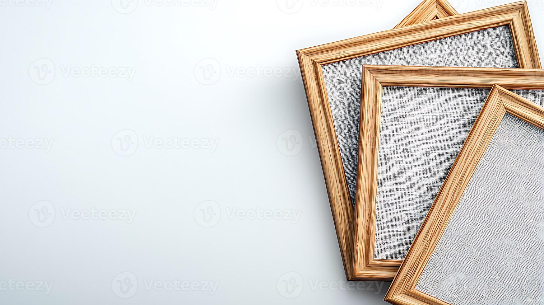 Three empty wooden picture frames arranged artistically on a light background photo