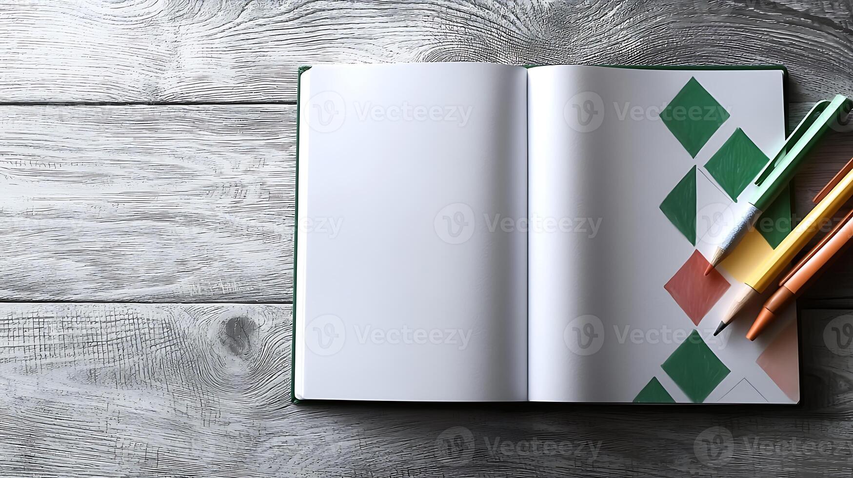 Open notebook with blank pages and colorful pens on a wooden table, ready for creative ideas photo