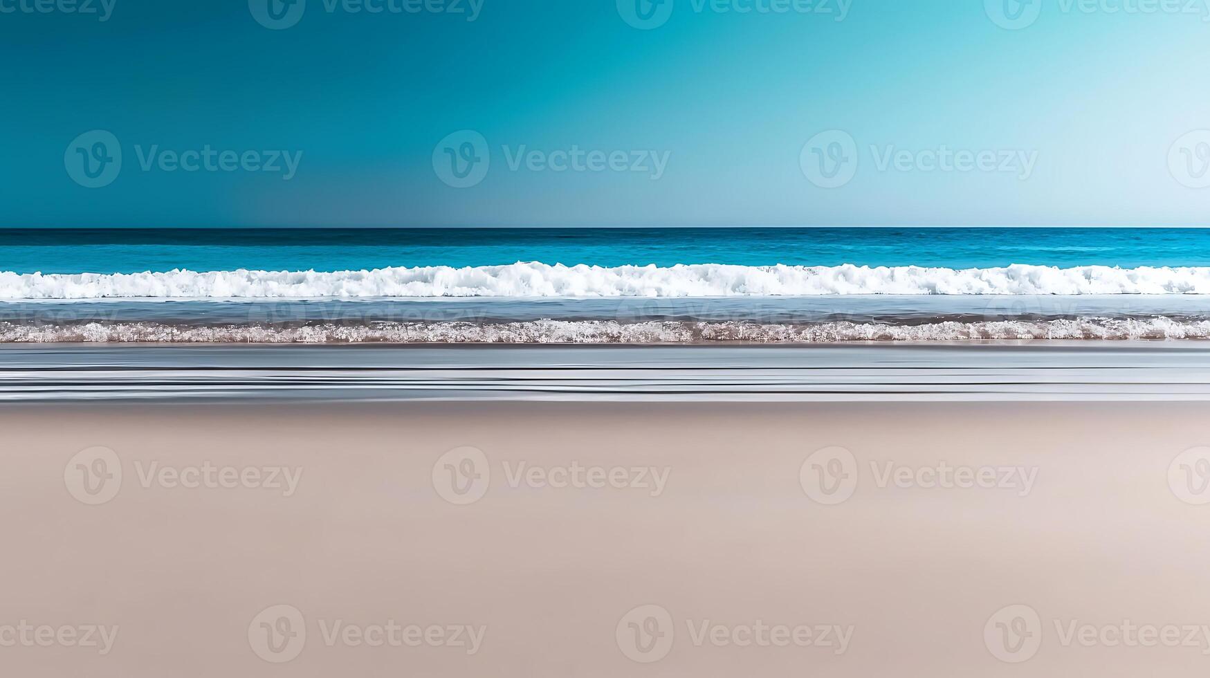 Serene beach scene with gentle waves lapping at the shore under a clear blue sky 1 photo