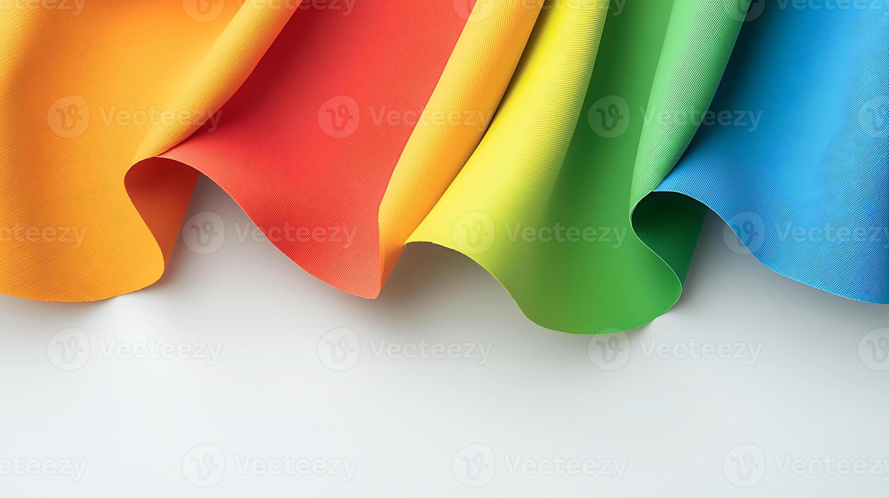 Vibrant, flowing fabric in rainbow colors draped elegantly on a white surface, showcasing texture photo