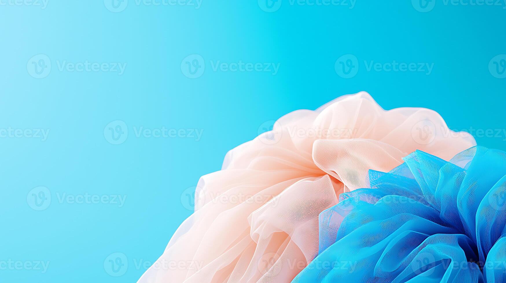 Soft pastel-colored tulle fabric drapes elegantly against a vibrant blue background, evoking a sense of calm photo