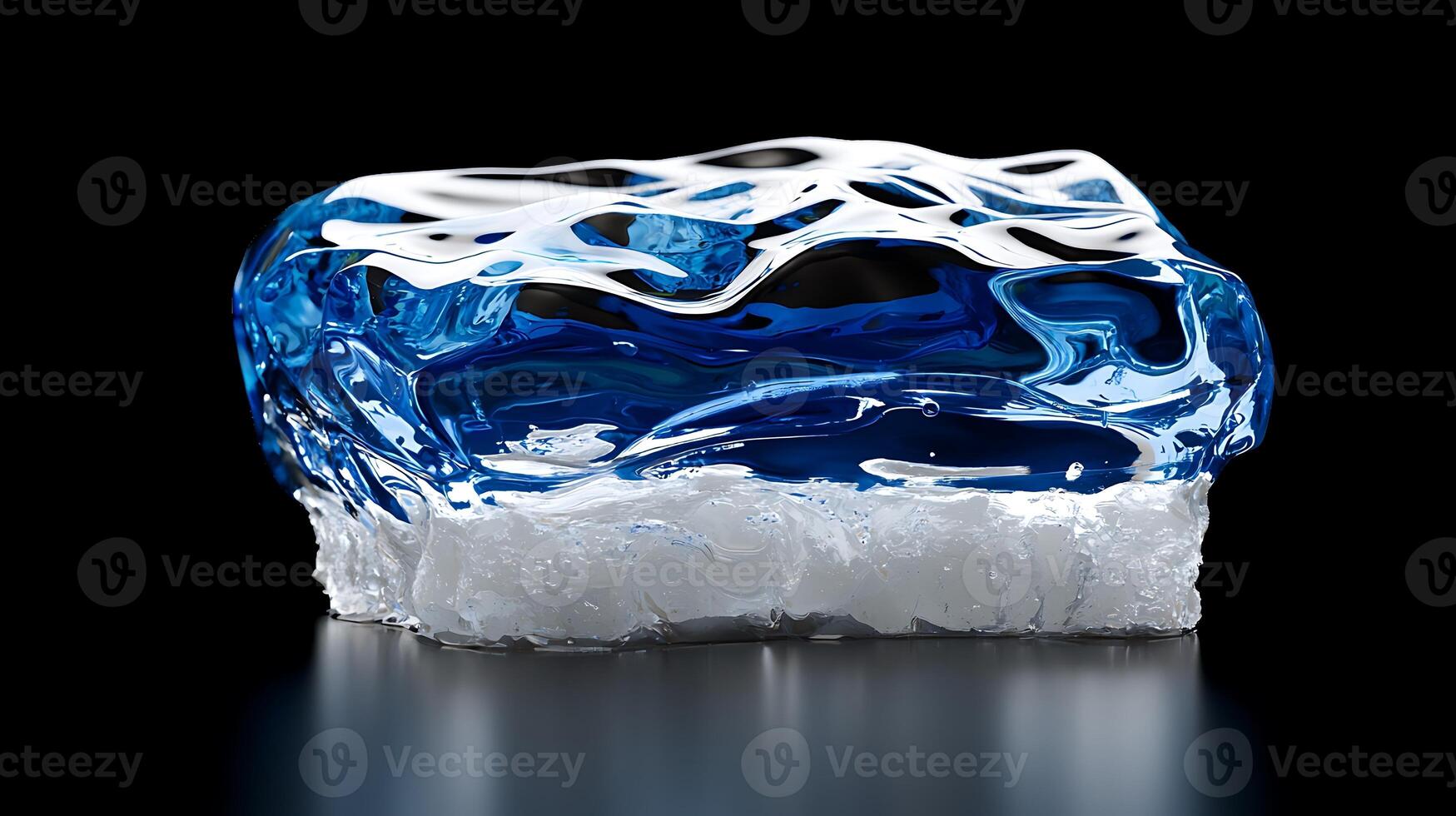 A crystal-clear ice block with blue accents, reflecting light against a dark background photo