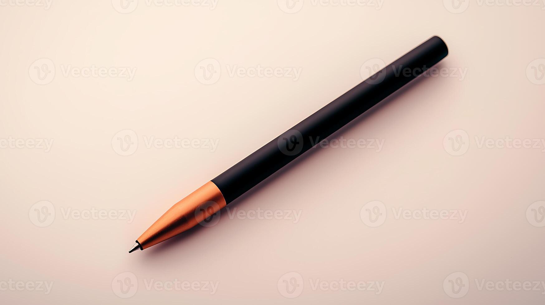 A sleek black and copper pen resting on a smooth surface, showcasing its elegance and design photo