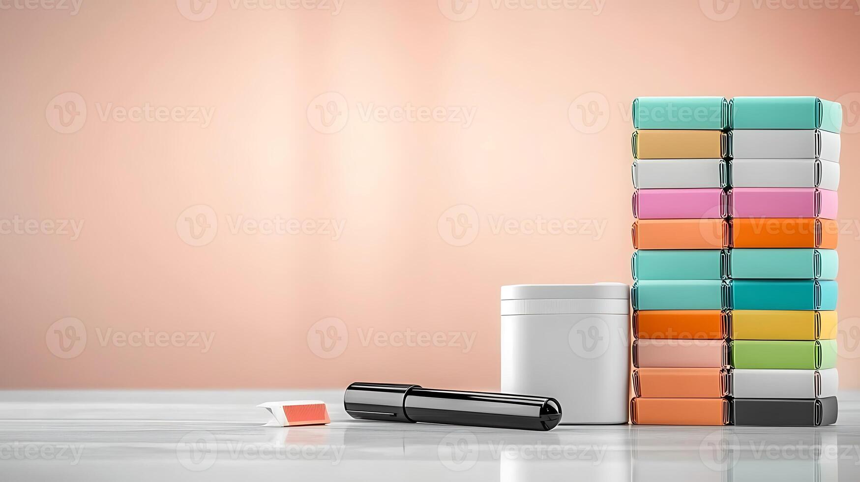 A neatly arranged stack of colorful boxes beside a white container and a black pen on a smooth surface photo