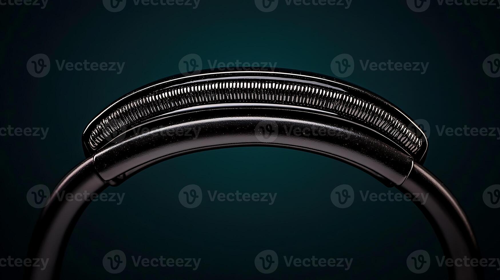Close-up of a sleek, curved metallic object against a dark gradient background, showcasing its design photo