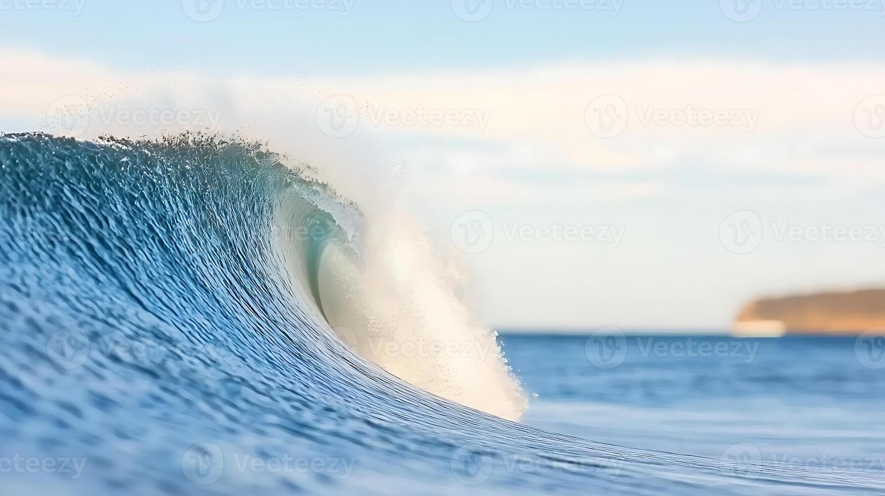 Majestic ocean wave curling gracefully under a clear sky at a serene beach location photo