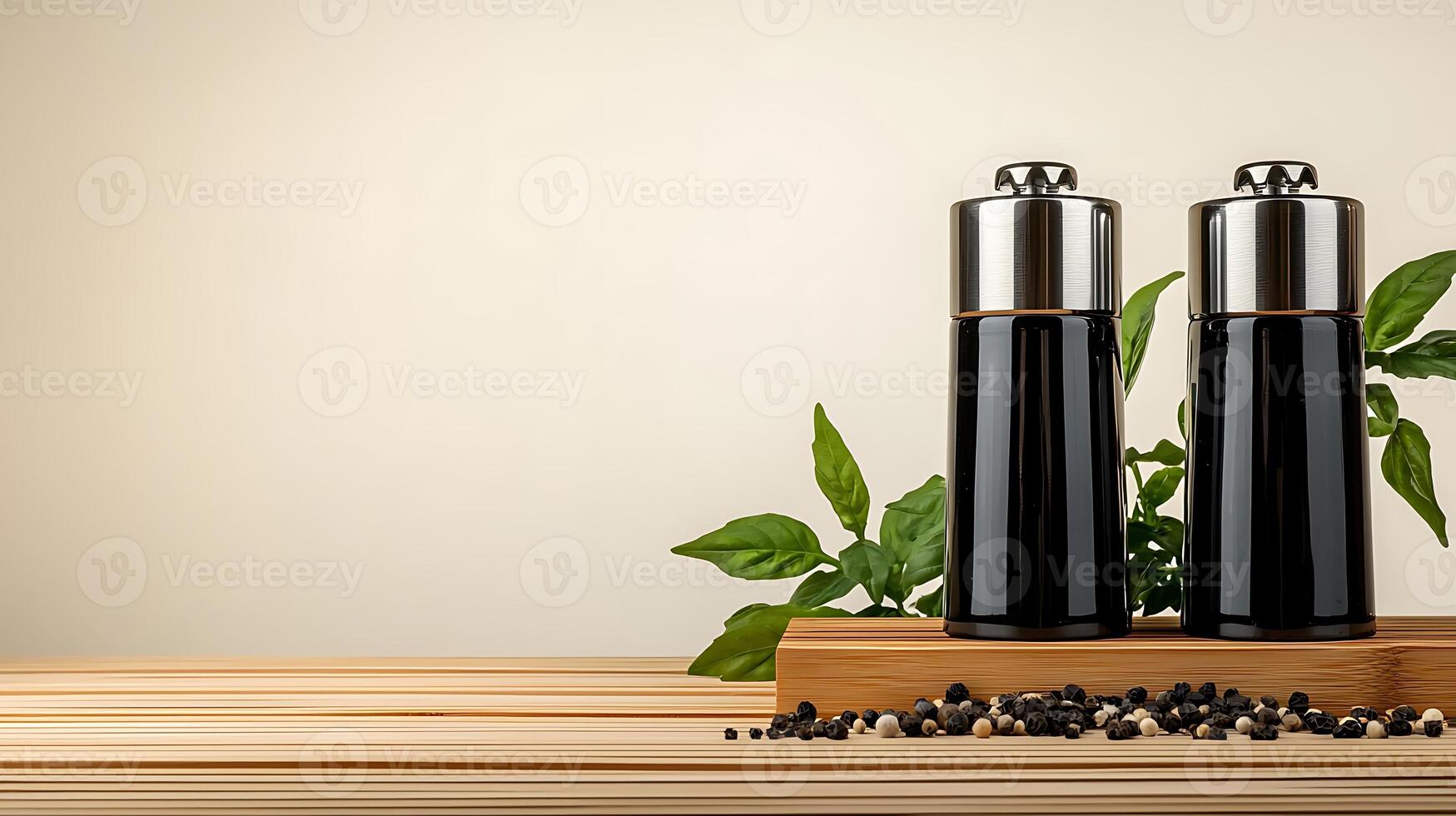 Sleek black pepper mills on a wooden board with green leaves and peppercorns, minimalist kitchen decor photo