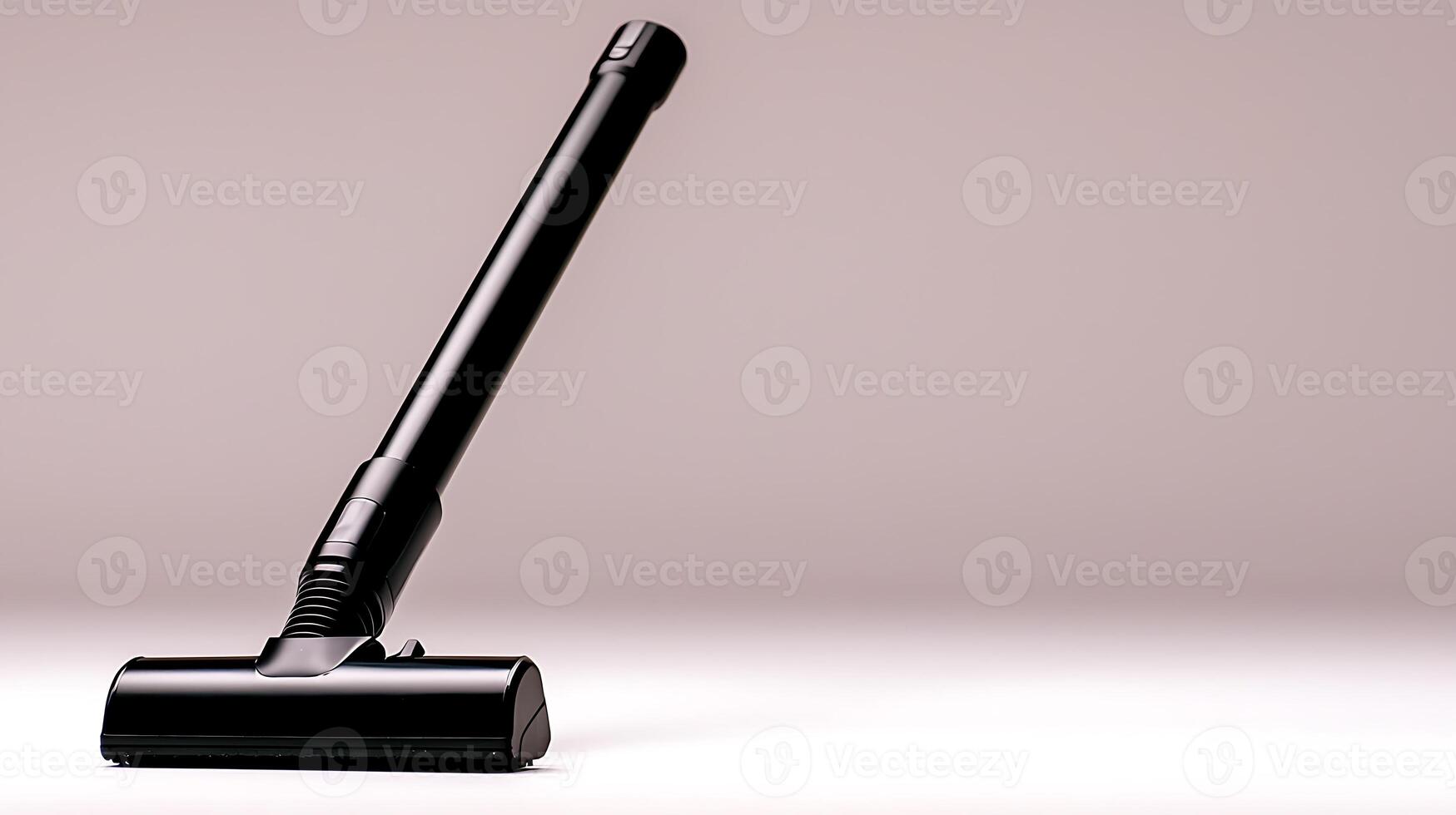 Sleek black vacuum cleaner nozzle positioned on a minimalist surface, showcasing modern design photo