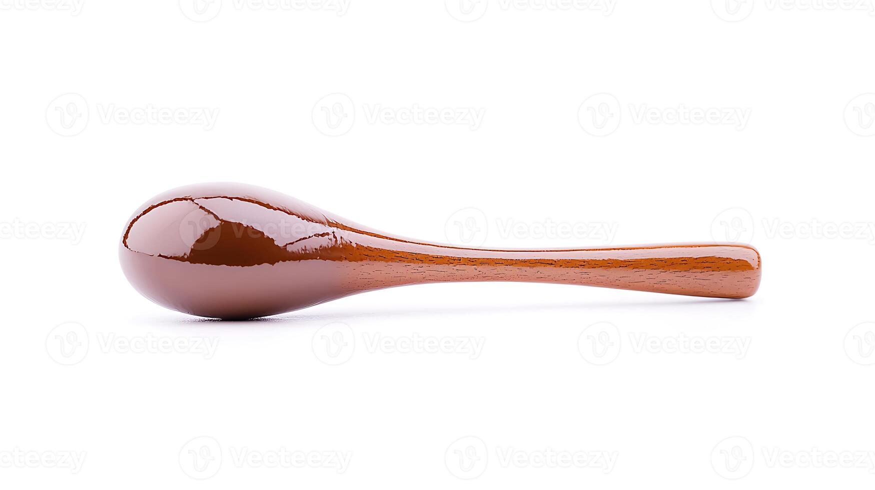 Smooth, glossy wooden maraca resting on a white background, ideal for musical themes and crafts photo