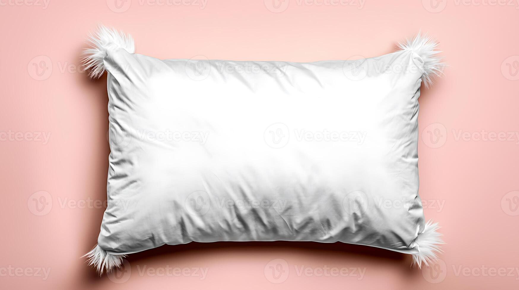 Soft white pillow with decorative tassels on a pastel pink background, ideal for home decor photo