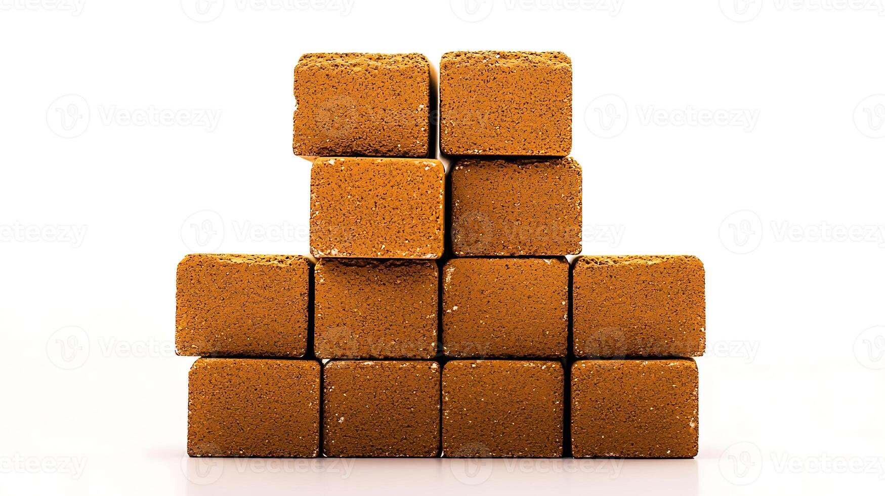 Stacked golden bricks arranged in a pyramid formation on a white background, highlighting texture photo
