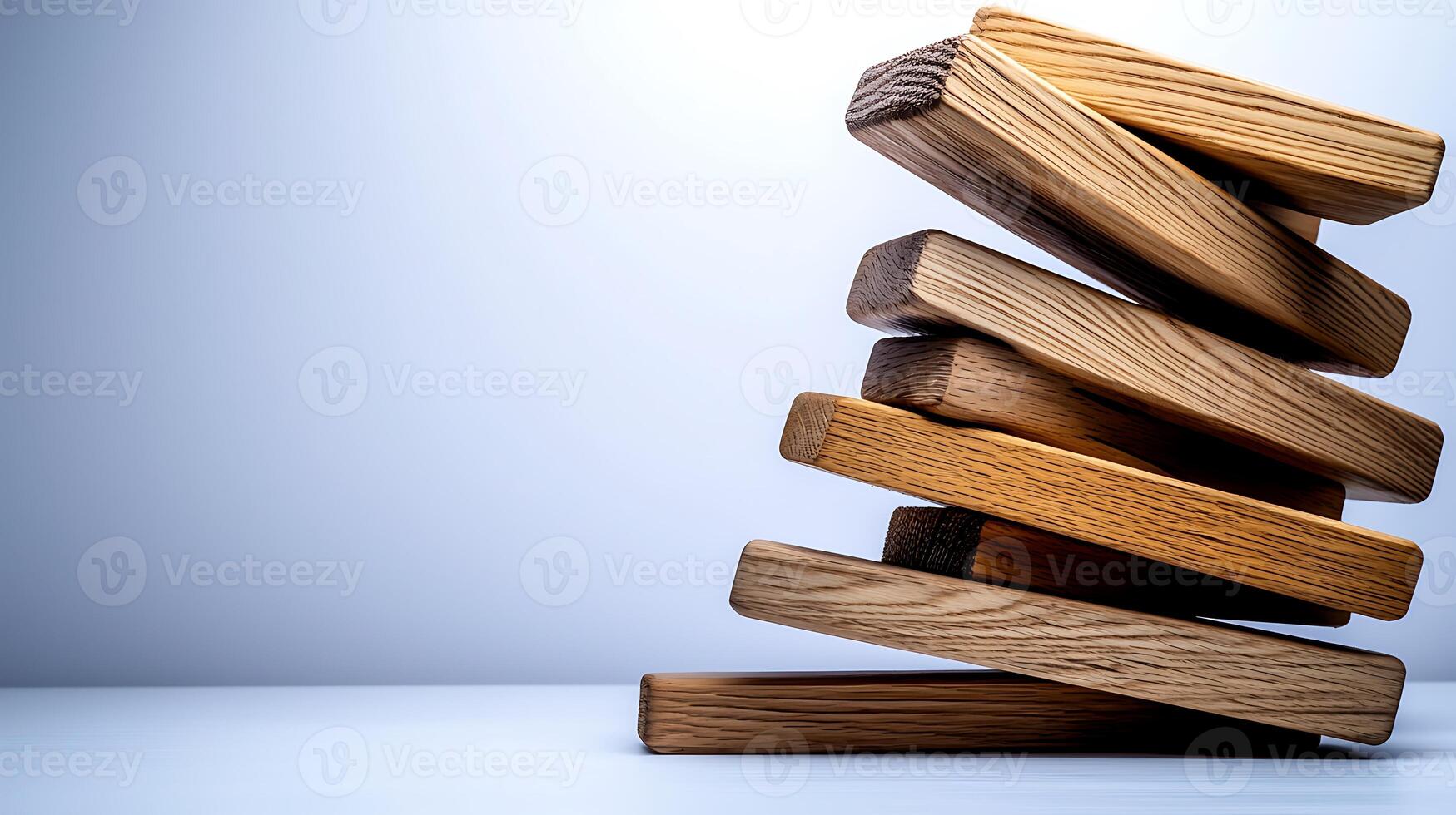 Stacked wooden blocks creating a balanced tower against a minimalist background photo