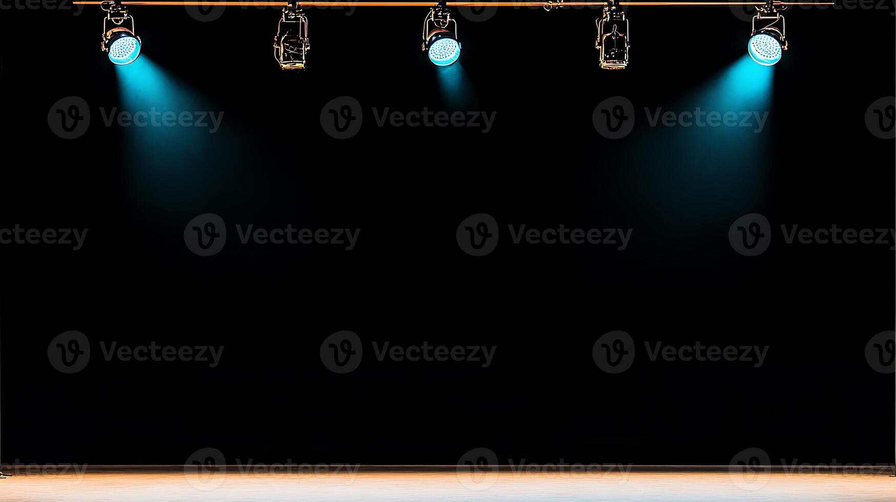 Stage lights illuminating an empty performance space with a dark background, ready for a show photo