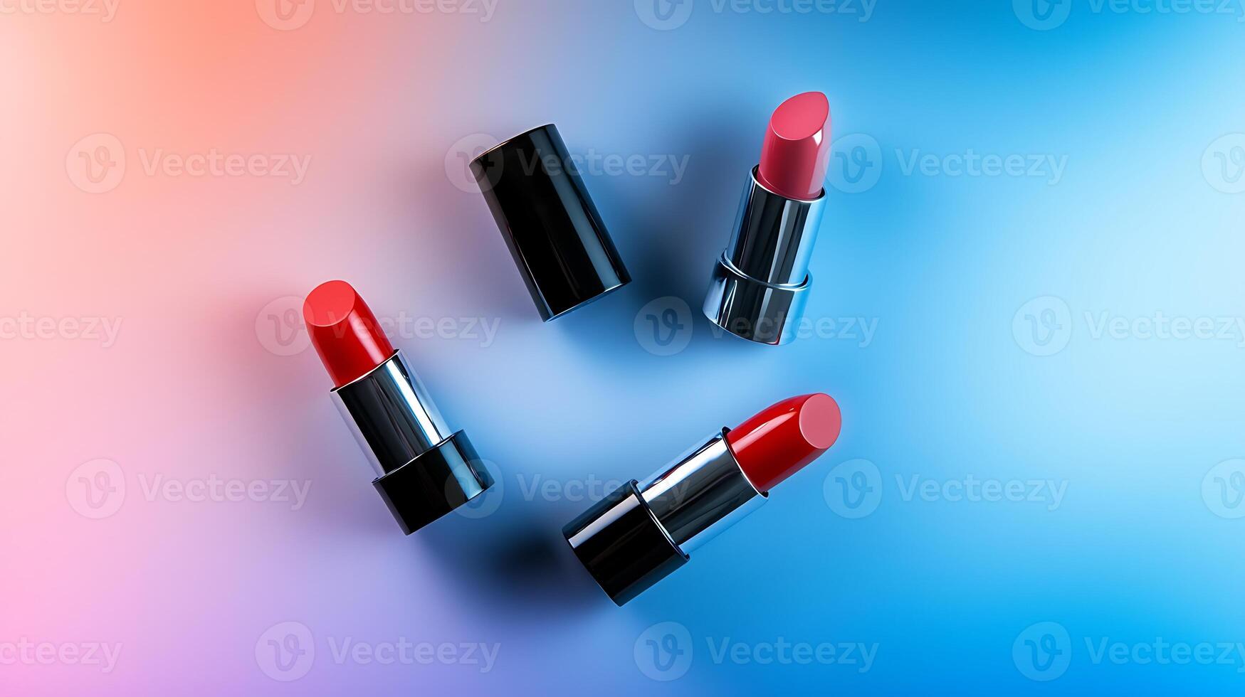 Three vibrant lipsticks in red and pink shades placed artistically on a gradient background photo