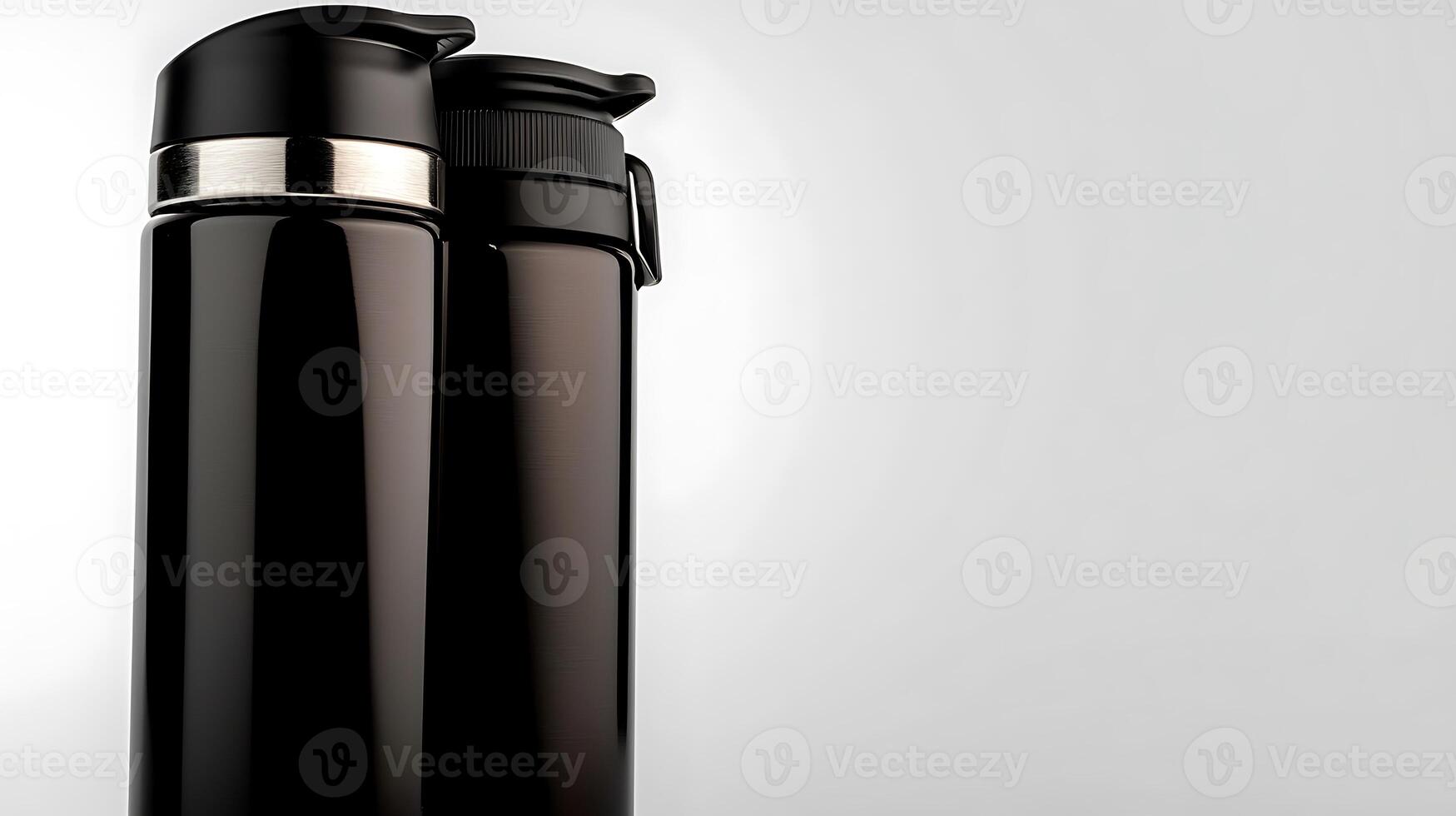 Two sleek black thermoses standing side by side on a minimalist background, showcasing modern design photo