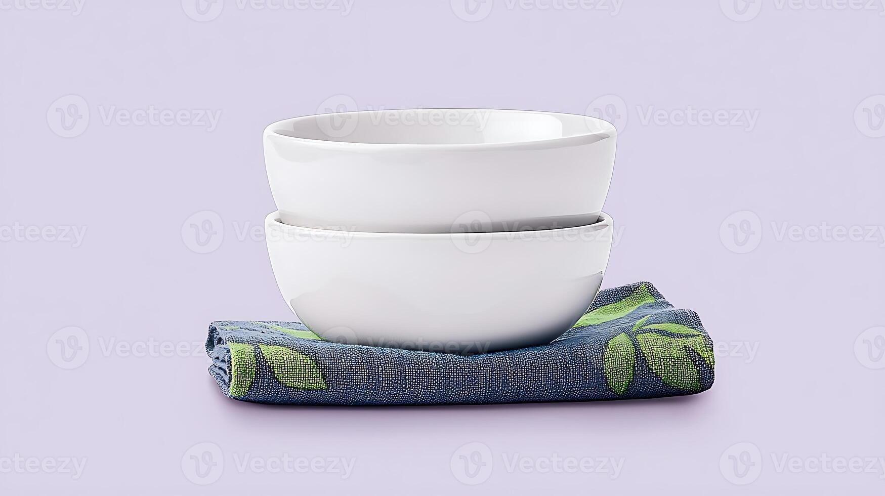 Two white ceramic bowls stacked on a blue cloth with green leaf patterns against a pastel background photo