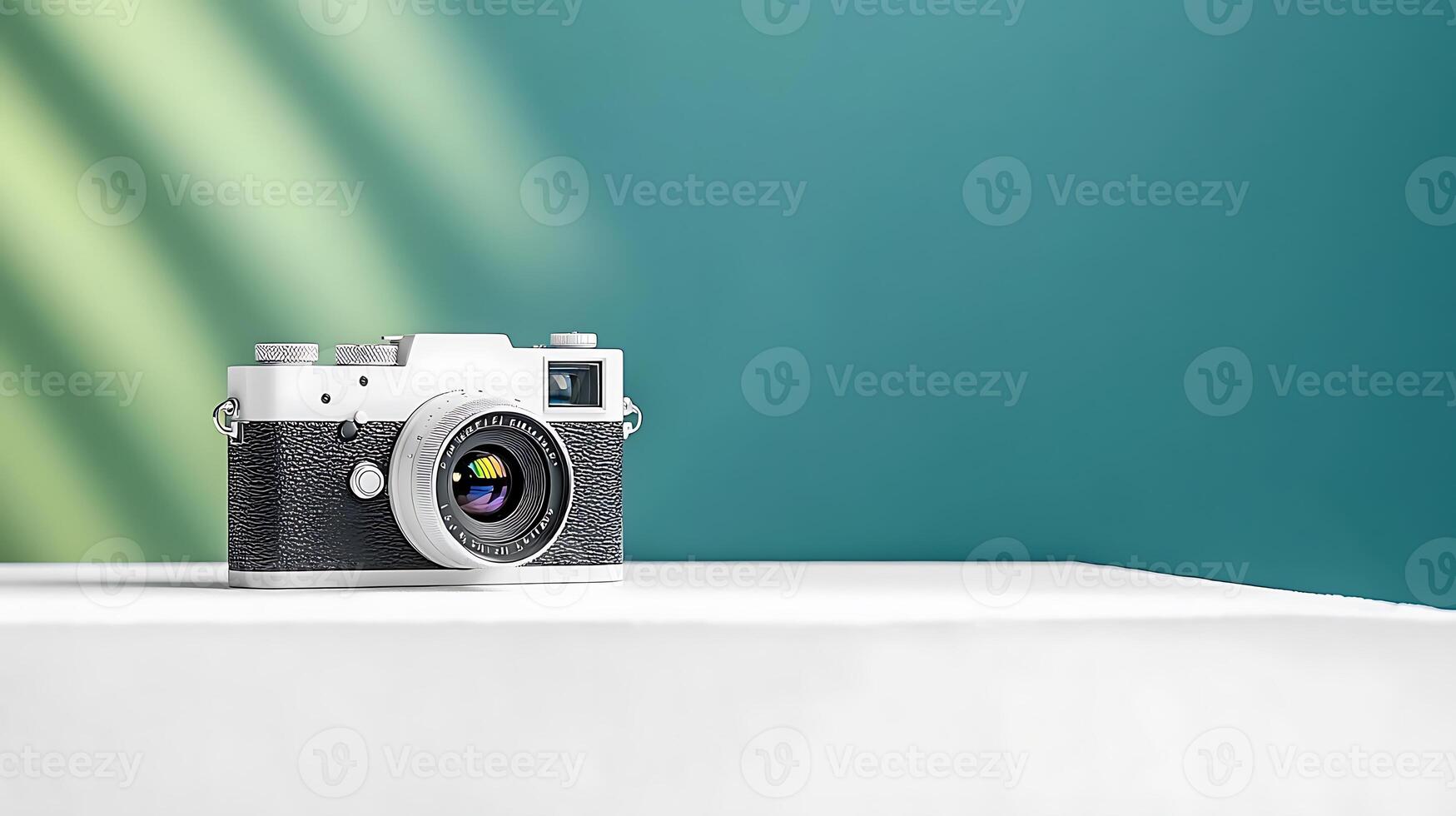 Vintage camera on a minimalist table against a vibrant backdrop with soft shadows photo