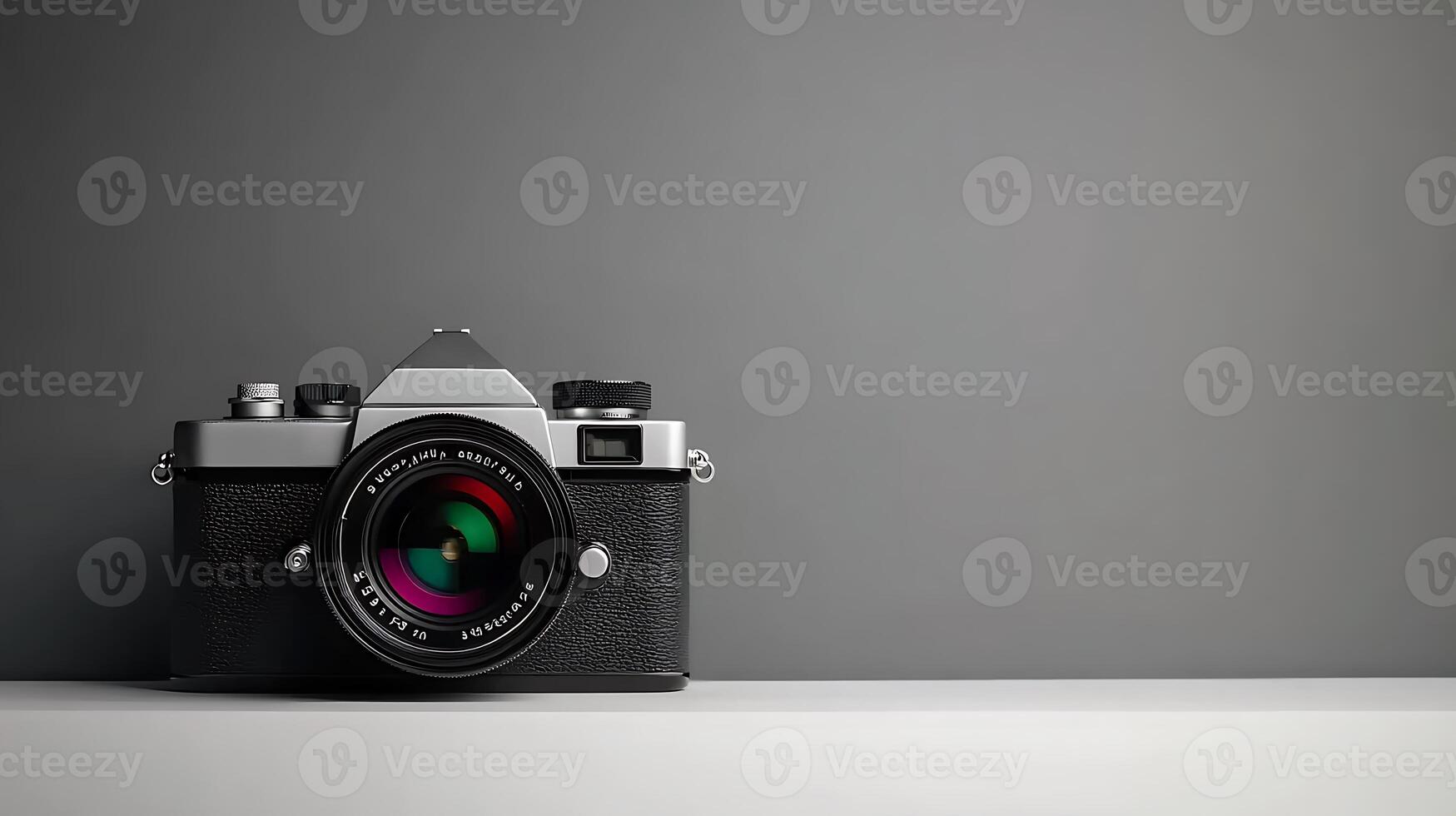 Vintage camera resting on a minimalistic surface against a gray background, showcasing elegance photo