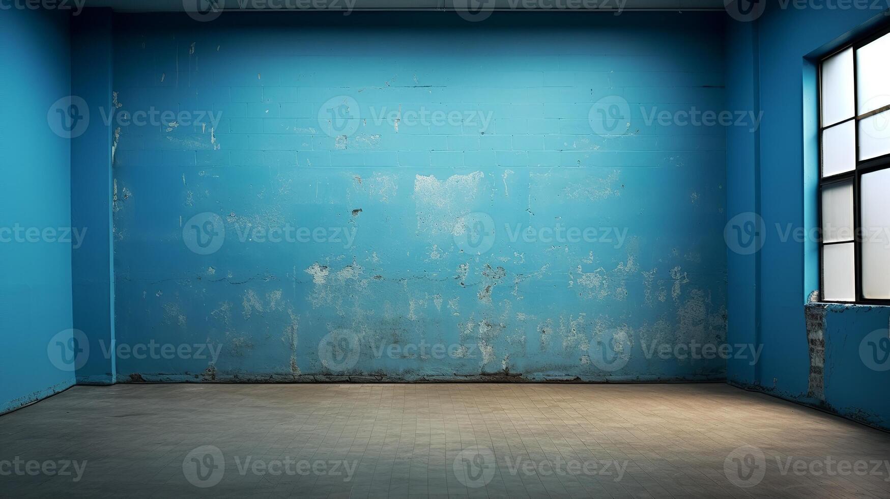 An empty room with blue walls and a window photo
