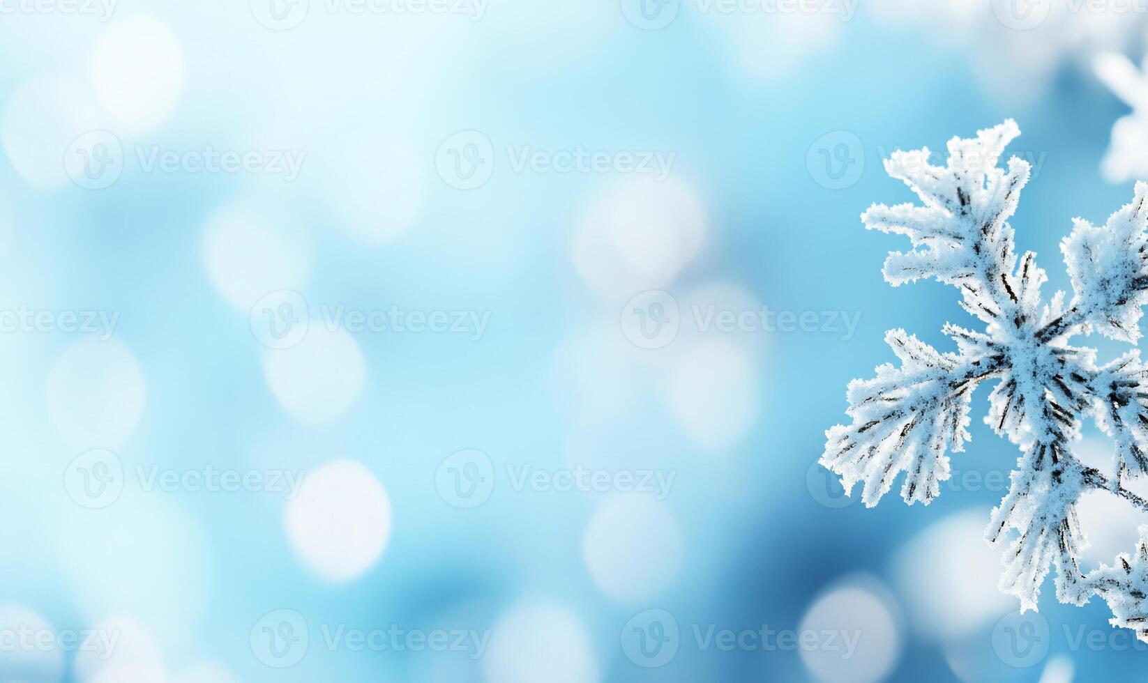 A snowflake is shown in front of a blue background photo