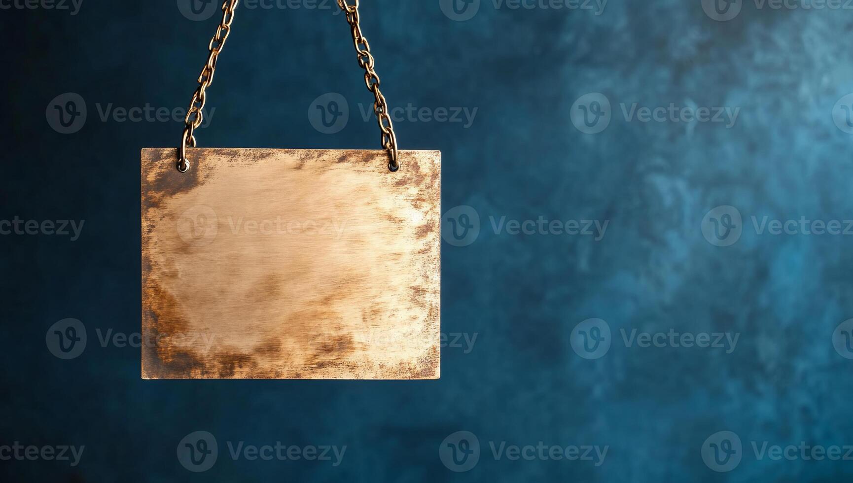 A metal plate hanging from a chain on a blue wall photo