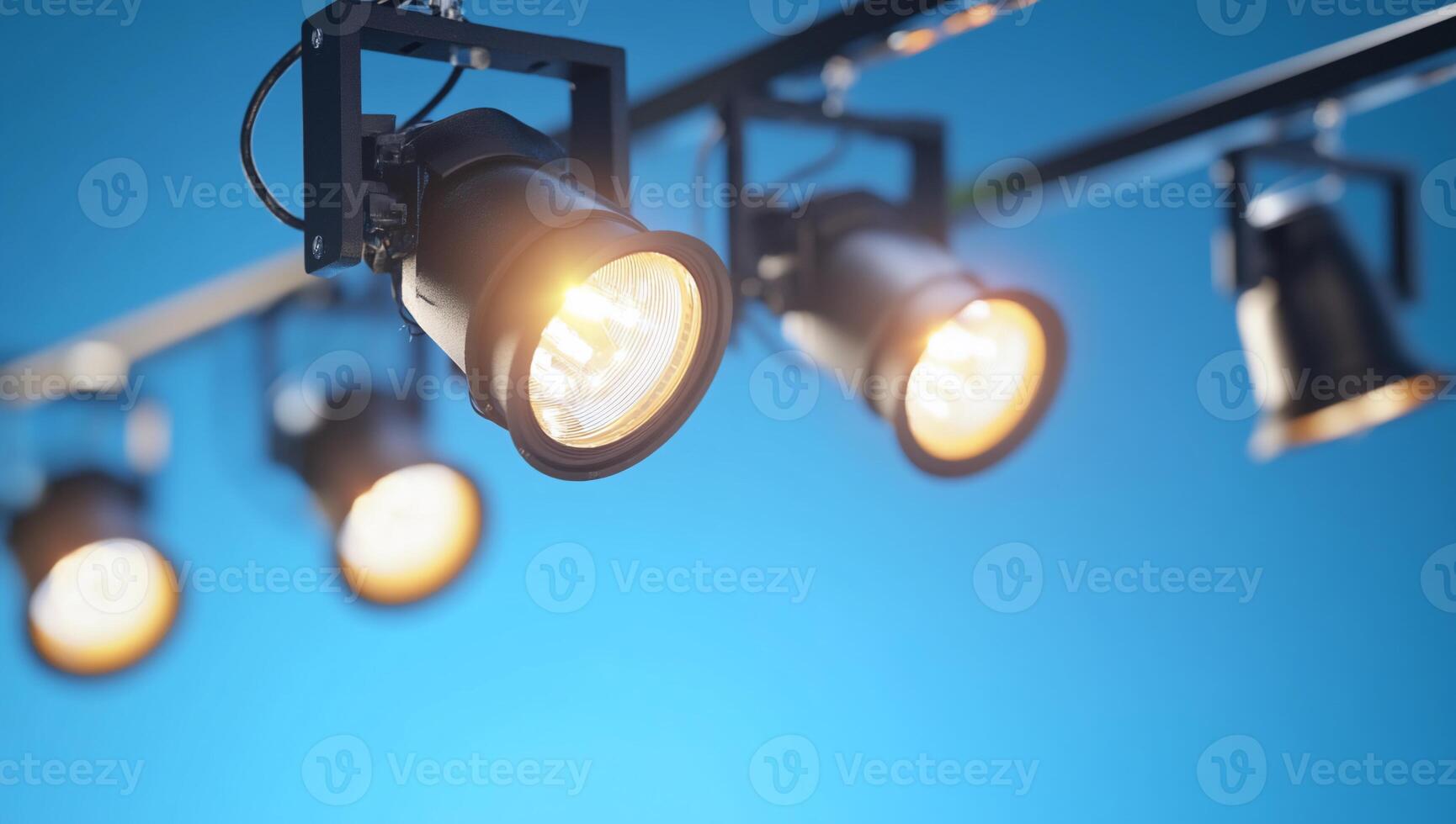Spotlights on a blue background photo