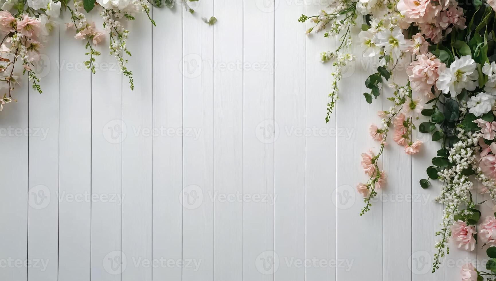 A white wall with pink and white flowers photo