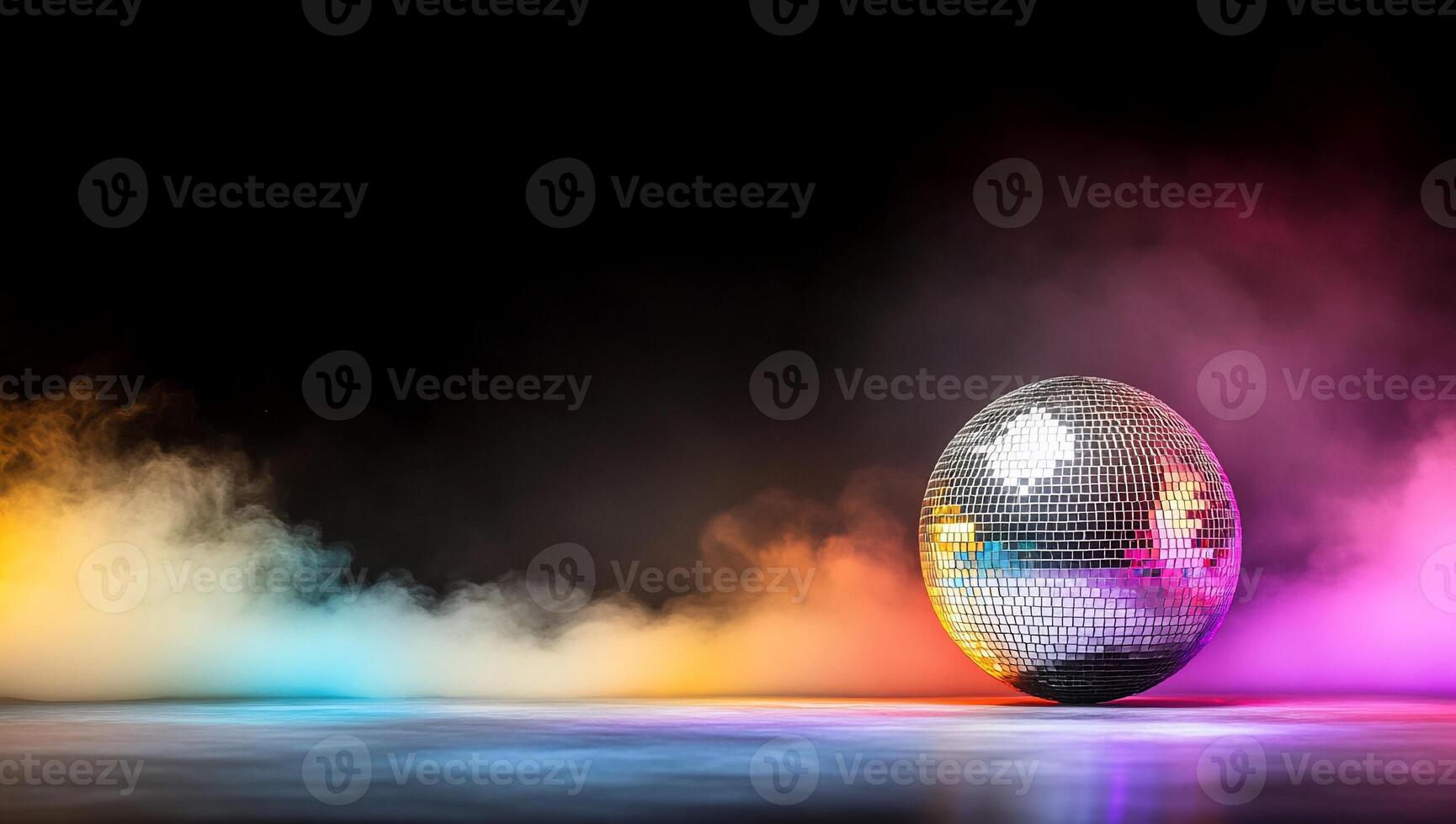 A reflective disco ball amidst colorful smoke and vibrant lighting. photo