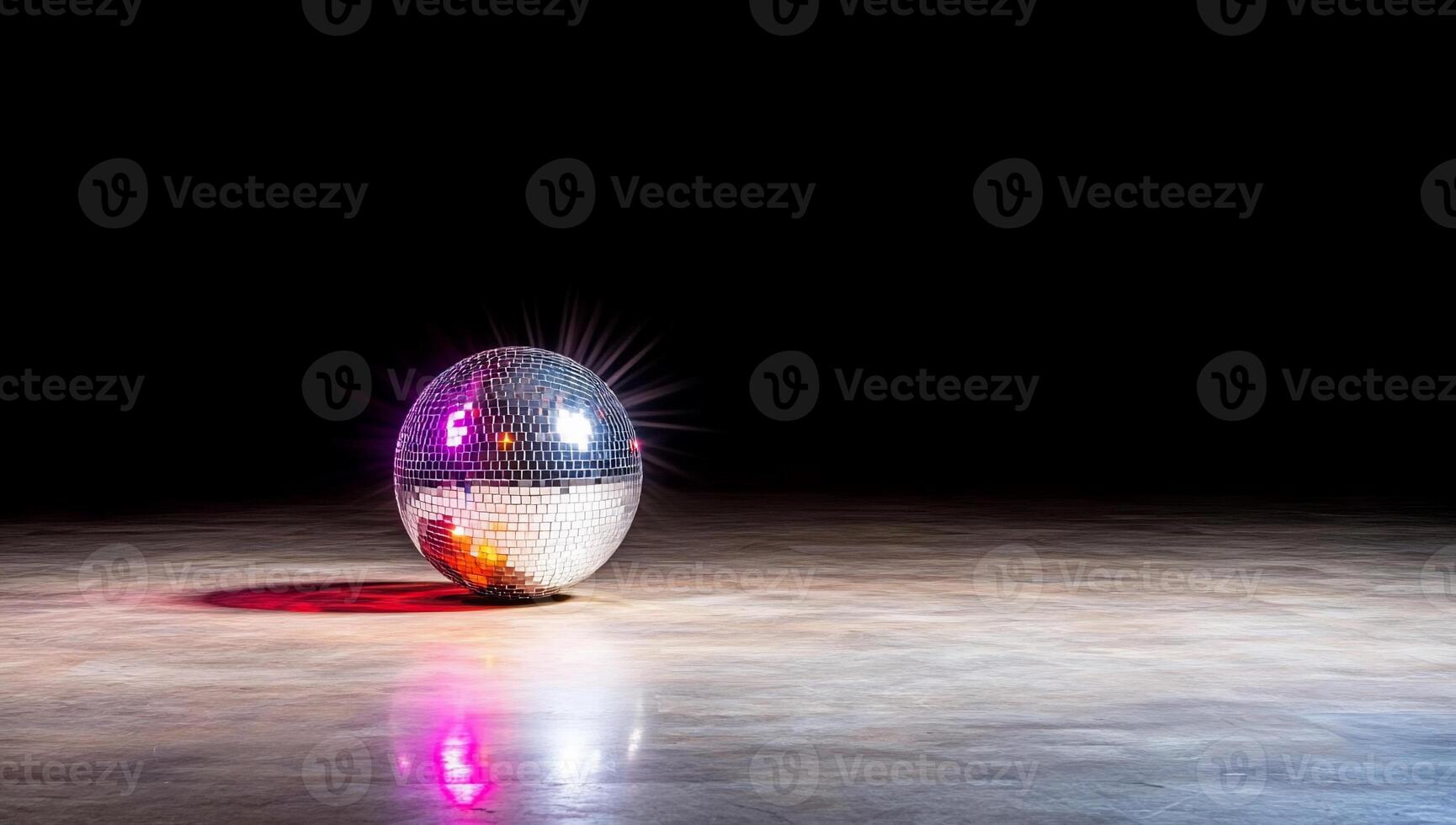 A reflective disco ball on a dance floor, creating a vibrant atmosphere. photo