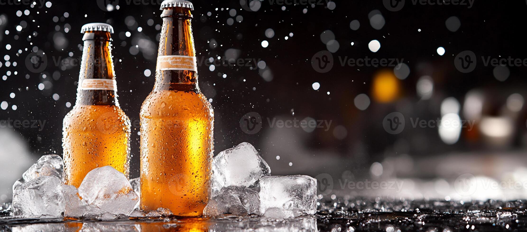 Two beer bottles with ice on a black background photo