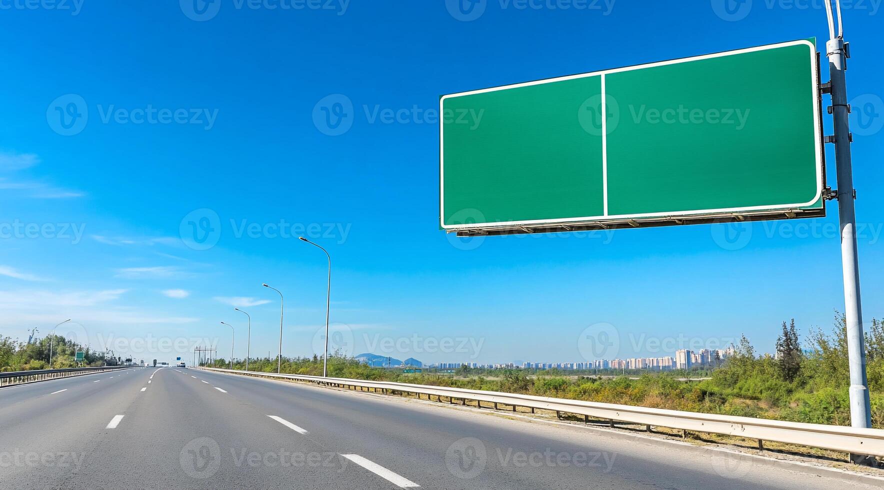 A clear highway scene with a blank billboard under a blue sky. photo
