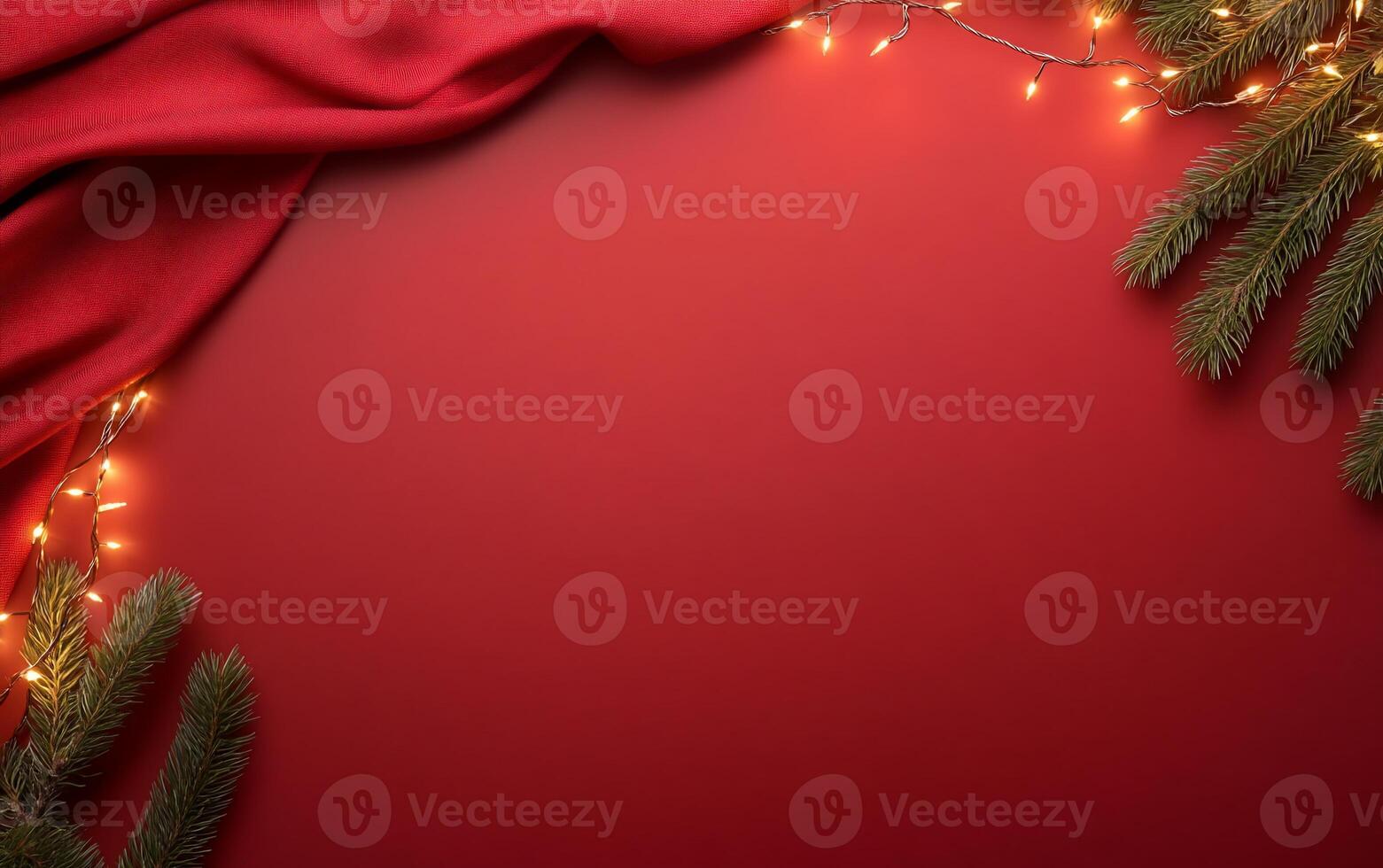 A festive arrangement with red fabric, lights, and evergreen branches. photo