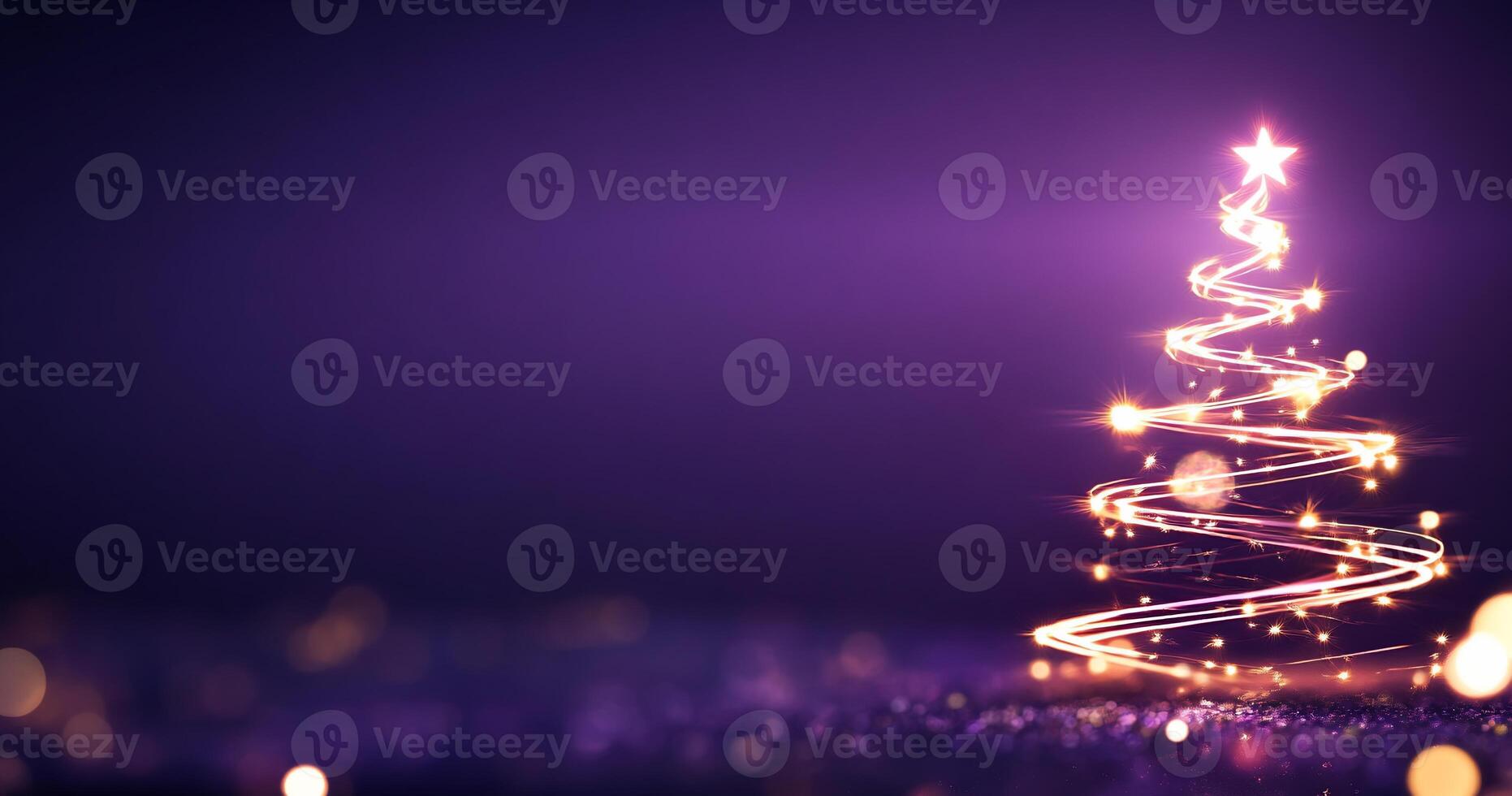 A glowing Christmas tree with lights against a purple background. photo